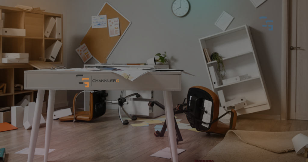 Messy home office scene with overturned chair, scattered papers, fallen shelves, and a cluttered desk, representing chaos, burnout, or workplace overwhelm, with subtle ChannlerG branding.