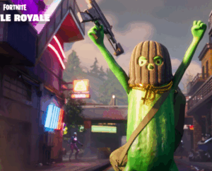 Fortnite character in a pickle costume with arms raised, wearing a ski mask and gold chains in a neon-lit city.