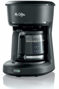 Compact Mr. Coffee drip coffee maker with glass carafe and power button.