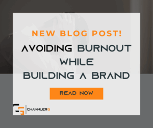 A stressed-out entrepreneur holding their head in their hands with overlay text that reads “New Blog Post: Avoiding Burnout While Building a Brand. Read Now.”