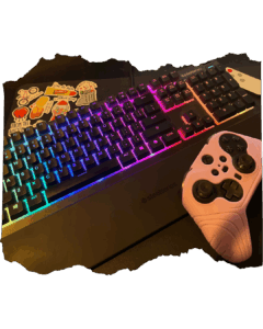 RGB SteelSeries keyboard with colorful stickers and a pink gaming controller resting on the wrist pad.