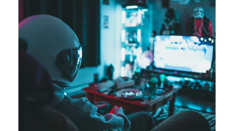 Person in astronaut helmet gaming in a neon-lit room with collectibles and a glowing TV screen