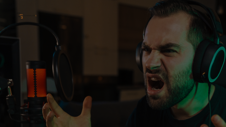 Frustrated gamer yelling into a headset while streaming with a red-lit microphone in front of him.