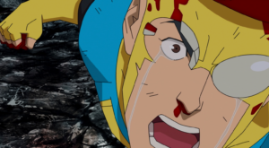 Close-up of Invincible with blood on his face and tears streaming down his cheeks during an intense emotional scene.