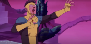 Injured Invincible reaches forward with blood on his face and chest during an intense animated battle scene.