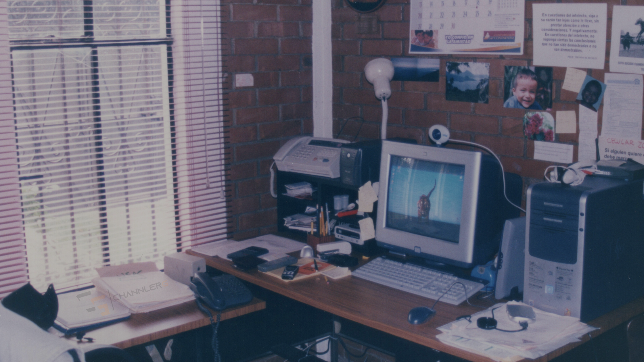 Vintage early-2000s home office setup with CRT monitor and desktop tower.