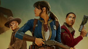 Three Fallout characters standing back to back, including a woman in a Vault suit holding a rifle, a scarred man in a cowboy hat, and a man in red armor holding a pistol.