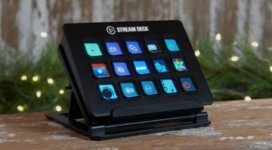 Elgato Stream Deck with customizable LCD keys on a stand, displayed on a wooden desk.
