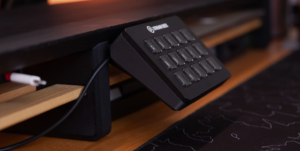 Elgato Stream Deck mounted under a desk using a bracket for a clean streaming setup.
