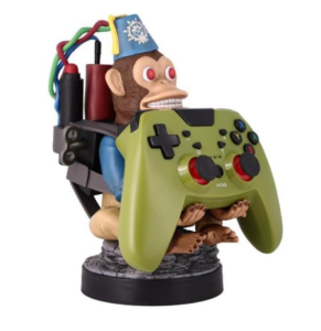 Monkey Bomb gaming controller holder figurine holding a green Xbox-style controller.