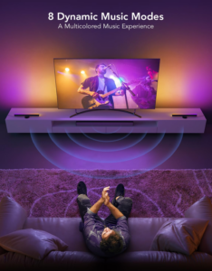 RGB TV light bars reacting to music with colorful lighting effects while a concert plays on screen in a living room.