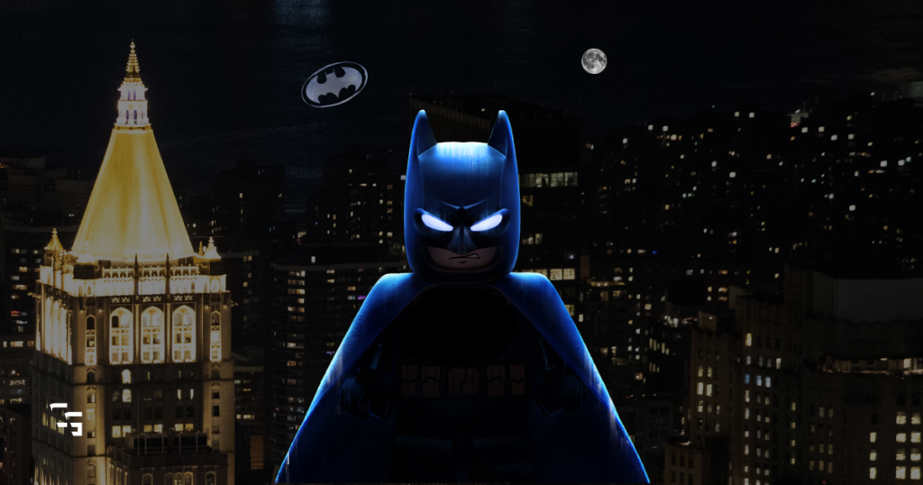 LEGO Batman standing over a Gotham City skyline at night with glowing blue eyes, the Bat-Signal in the sky, and a full moon in the background.