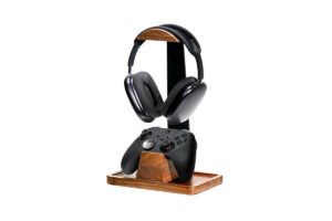 Wooden gaming accessory stand holding a wireless headset and Xbox-style controller, designed for organizing gaming gear and reducing desk clutter.