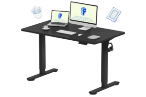 FLEXISPOT EN1 electric standing desk with adjustable height frame, black desktop, monitor, laptop, keyboard, and minimalist home office setup.