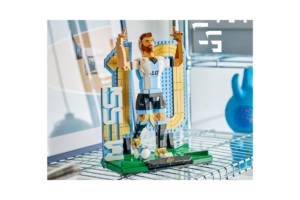 LEGO Lionel Messi display model featuring the Argentine soccer star in his number 10 jersey, posed in celebration beside a large number 10 backdrop and soccer ball.