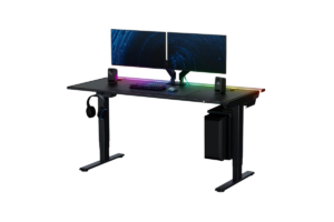 Secretlab MAGNUS Pro electric standing desk with dual monitors, RGB lighting, speakers, and a premium gaming PC setup.