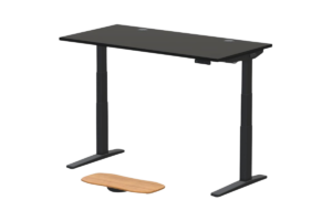 UPLIFT V3 standing desk with a black desktop, cable grommets, and balance board for an ergonomic home office or gaming setup.