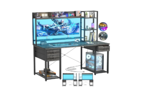 Aheaplus gaming desk with LED lighting, storage shelves, drawers, monitor stand, and PC tower space