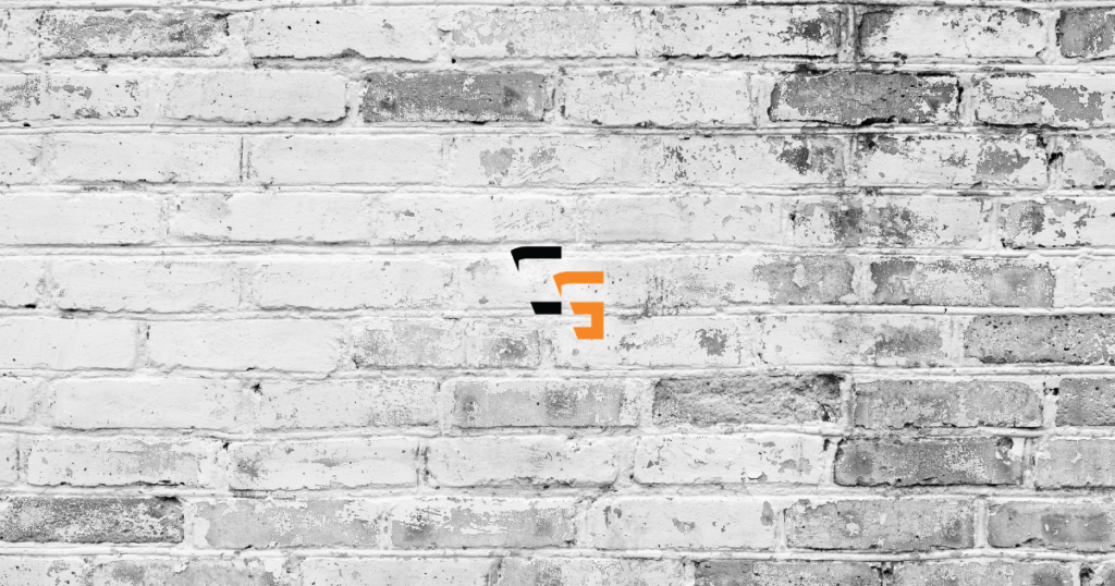 ChannlerG logo centered on a weathered white brick wall background.