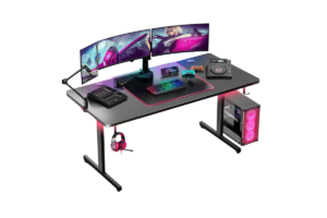 GTPLAYER 55-inch gaming desk with triple monitors, RGB lighting, PC tower, and gaming accessories