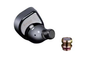 Close-up of a SIMGOT EW300 in-ear monitor with interchangeable tuning nozzle removed beside the earpiece.