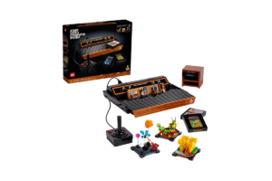 LEGO Icons Atari 2600 set 10306 featuring a brick-built retro gaming console, joystick controller, game cartridges, and miniature video game scenes.