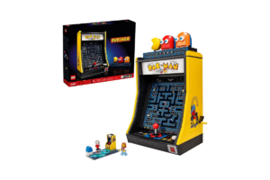 LEGO Icons PAC-MAN Arcade set 10323 featuring a yellow brick-built arcade machine with a classic PAC-MAN maze, colorful ghost characters, joystick, and original LEGO packaging.
