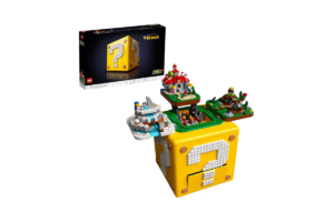 LEGO Super Mario 64 Question Mark Block set 71395 featuring a yellow brick-built question mark cube with miniature Super Mario 64 levels displayed on top and original LEGO packaging.